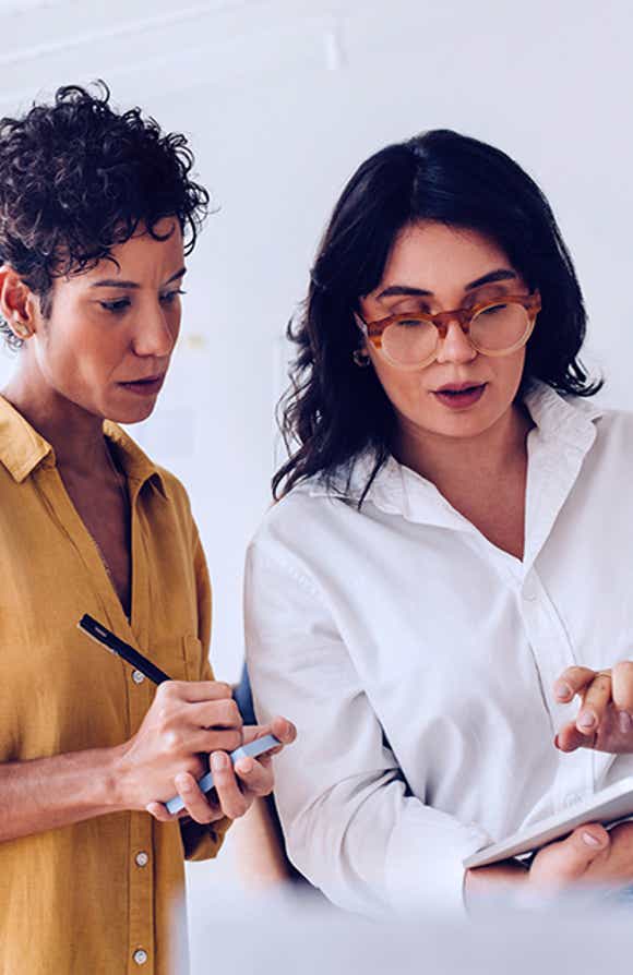 manager reviewing her sales reps current opportunities helping them effectively manage their sales pursuit