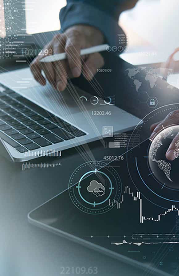 picture of a man's hand working on a laptop with graphics coming out of it that show connectivity between data for measurement and analysis
